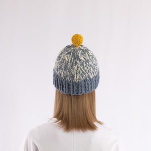 Hand-knitted bulky pompom beanie in Blue x Yellow