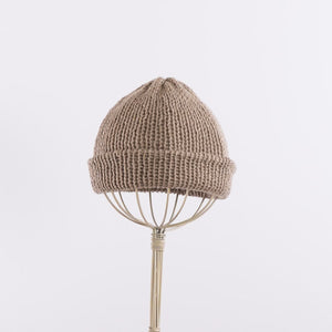 A simple shallow beanie in Taupe