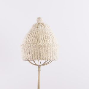 Purl stitch beanie with crocheted mini pompom in Natural