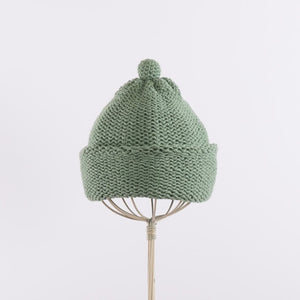 Purl stitch beanie with crocheted mini pompom in Sage