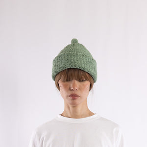 Purl stitch beanie with crocheted mini pompom in Sage