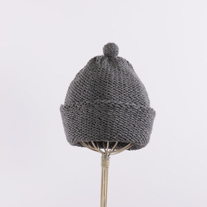 Purl stitch beanie with crocheted mini pompom in Mid-gray