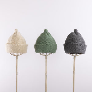 Purl stitch beanie with crocheted mini pompom in Sage